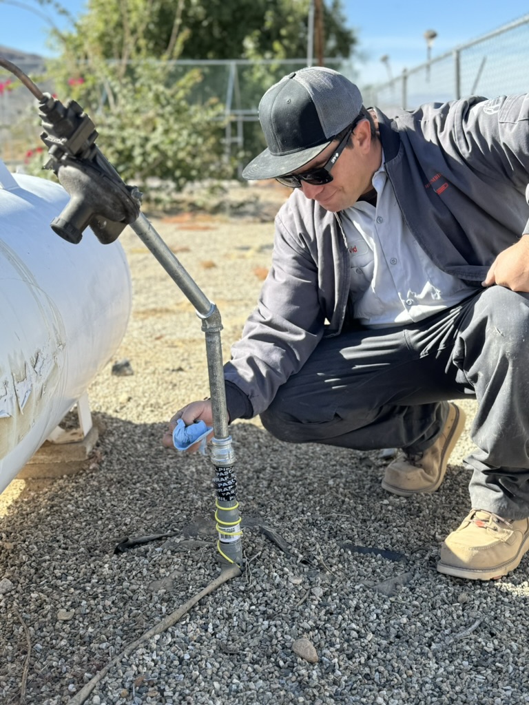 Plumber near me fixing plumbing under kitchen sink by HI-DESERT PLUMBING INC in Yucca Valley, CA