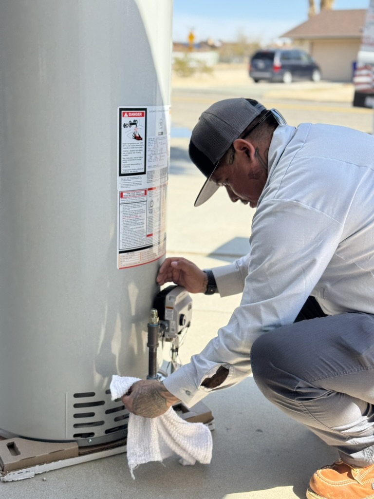 Plumber near me fixing plumbing under kitchen sink by HI-DESERT PLUMBING INC in Yucca Valley, CA