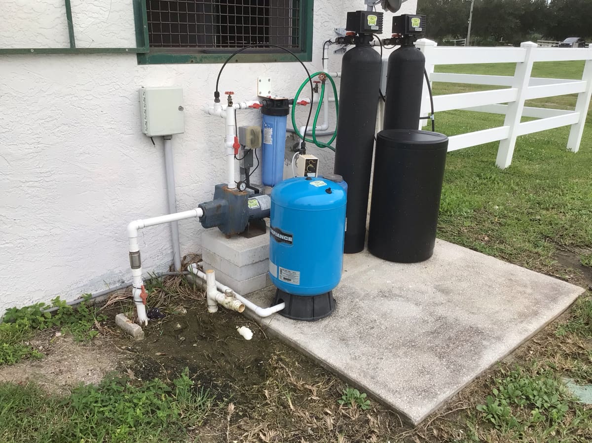 HI-DESERT PLUMBING INC. service truck at a desert well site